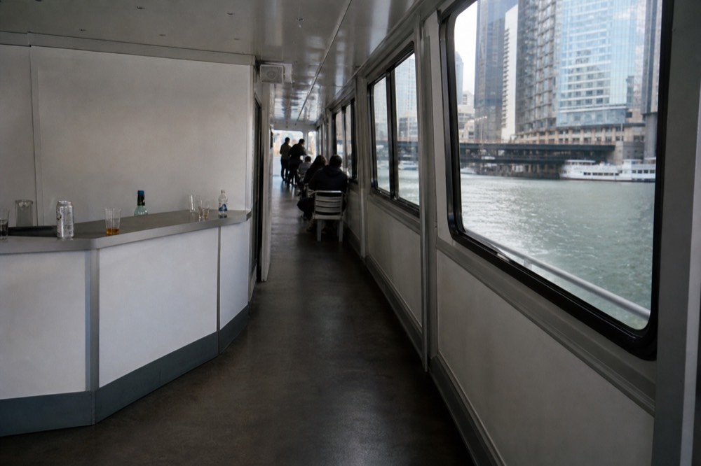 Tour boats docked on the Chicago Riverwalk near the Michigan Avenue bridge, no text, no logos, no people
